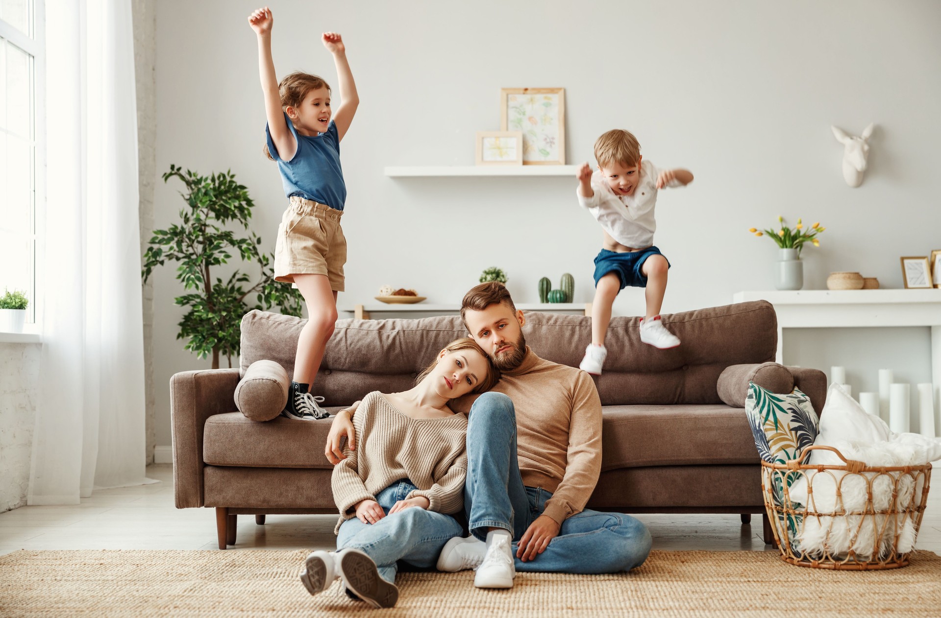 Tired parents spending day at home with kids